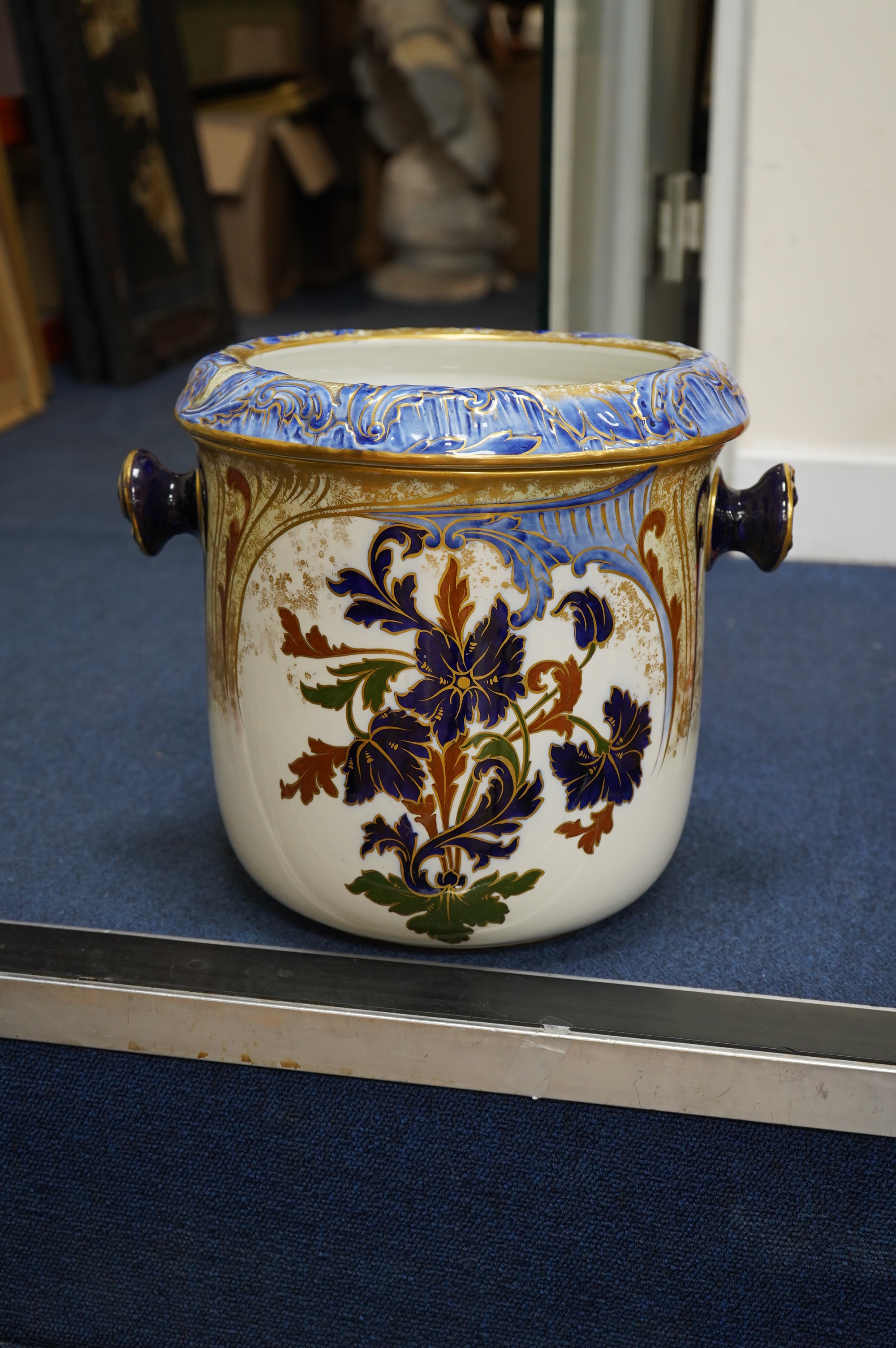 A Victorian Royal Doulton gilt and floral decorated pail, 28cm high. Condition - poor, crack to back